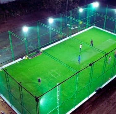 Technicians from Arjilli Safety Nets carefully fixing the nets along the terrace edges, focused and 
