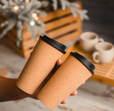 A woman holds takeaway coffees from the Beach Shak, Beachmere, Qld