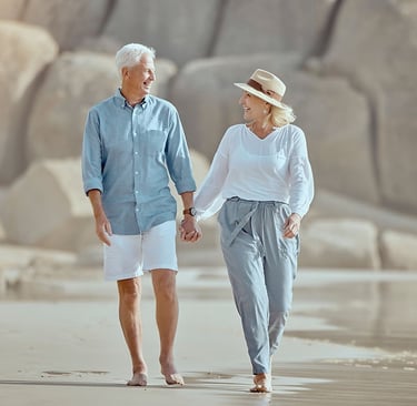 a couple walking on a beach