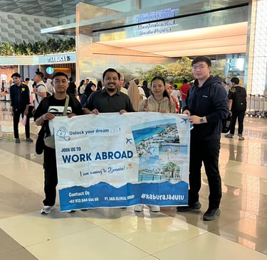 Crew ready for boarding, holding AKA banner at Soekarno-Hatta International Airport.
