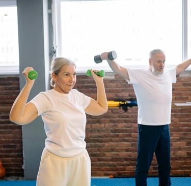 Older adults lifting light weights as part of active aging.