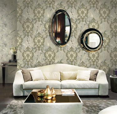 Elegant living room featuring damask pattern wallpaper, a white modern sofa, and circular wall mirrors.