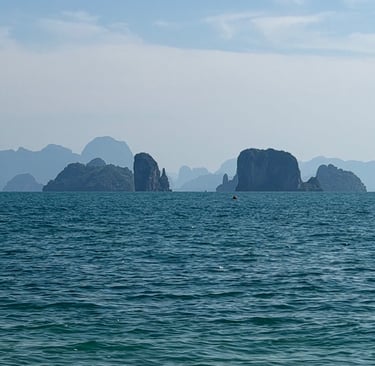 Scenic ocean view of limestone islands near Phuket coastline