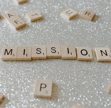 a close up of a wooden block with the words mission mission