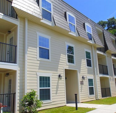 Renovated apartment exterior with new siding at Courtyard Commons in Jamestown NC
