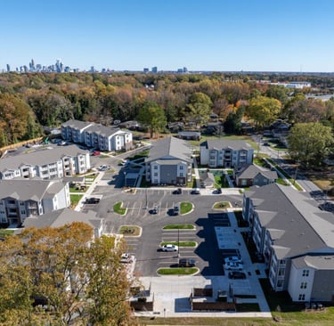 Aerial view of Evoke Living at Morris Field showing completed apartment buildings and parking layout in Charlotte, NC
