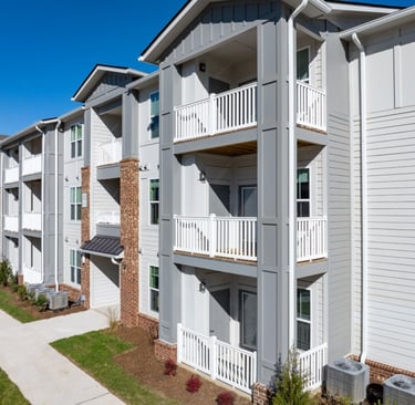 Exterior corridor view showing building alignment and balconies at Evoke Living at Morris Field in Charlotte, NC