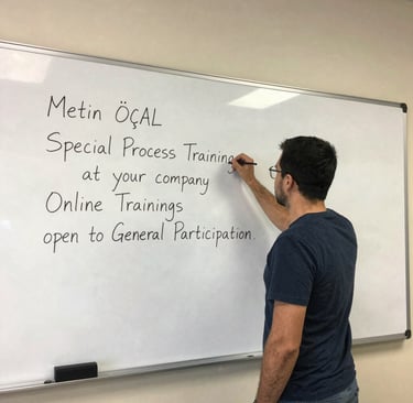 Close-up of hands examining automotive parts during a hands-on training session.