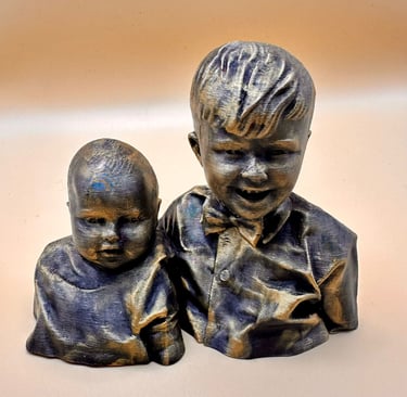 A 3D printed bronze bust sculpture of two young brothers with detailed textured layers and metallic finish.