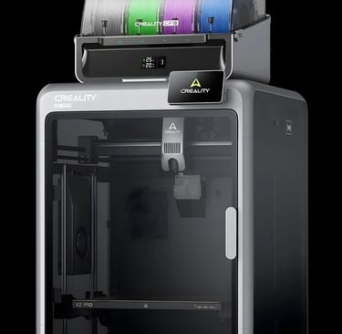 Creality K2 Plus 3D printer with CFS multi-color filament system and four spools.
