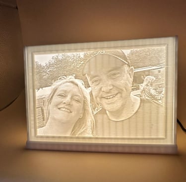 Custom 3D printed lithophane lamp featuring a backlit portrait of a smiling couple.
