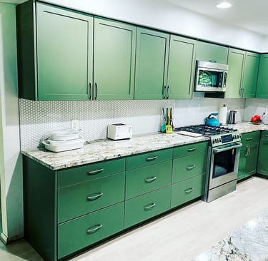 Custom upper and lower kitchen cabinetry in a unique finishing color, designed and handmade.