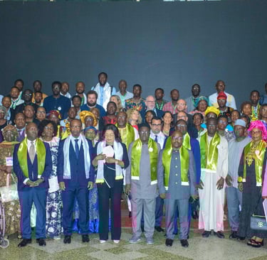 A large group of international delegates posing for a formal portrait at a global summit conference.
