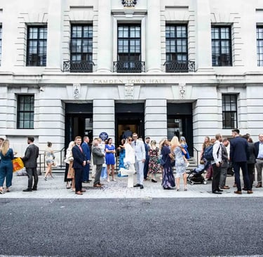 wedding party standing outside Camden Town Hall