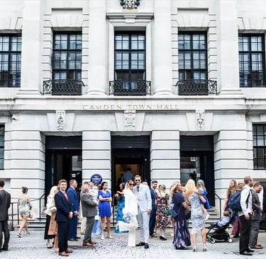 Wedding party standing outside Camden Town hall