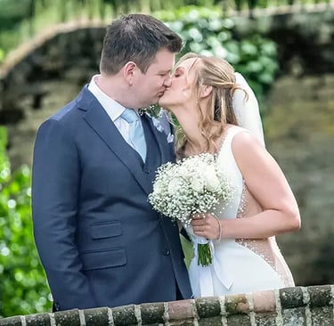 wedding couple sharing a kiss