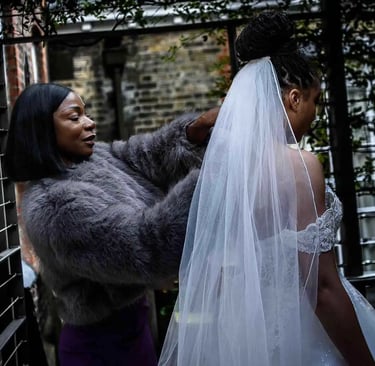 brides mother adjusting her daughters wedding veil