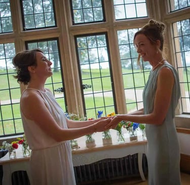 LGBTQ+ wedding couple saying their vows