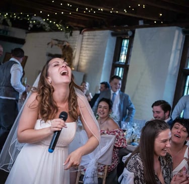 bride laughing during the speeches