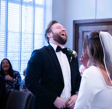 a man and woman are laughing and laughing