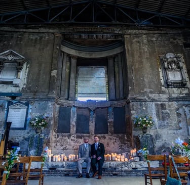 two grooms sitting inside the asylum chapel