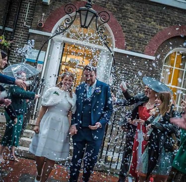 Newly weds walking through confetti at Southwark Registry Office