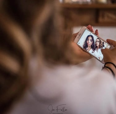 bride and bridesmaid taking a selfie