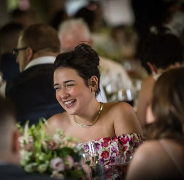 female wedding guest smiling