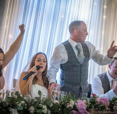 bride and groom giving a speech on their wedding day