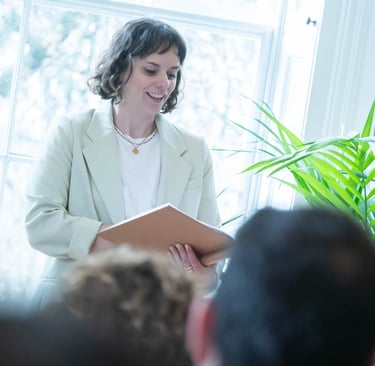 a woman in a white suit and a man in a suit