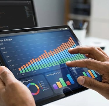 Tablet a exibir gráficos de performance e métricas de vendas digitais para Argos Consultora Digital