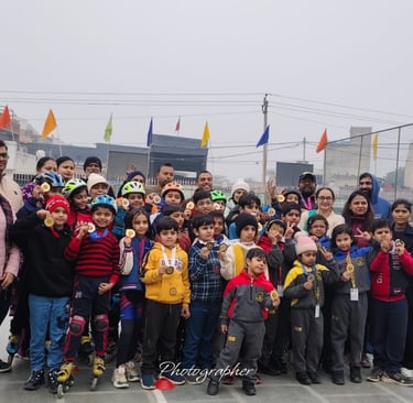 Young school students wearing roller skates and holding medals at a sports competition outdoors.
