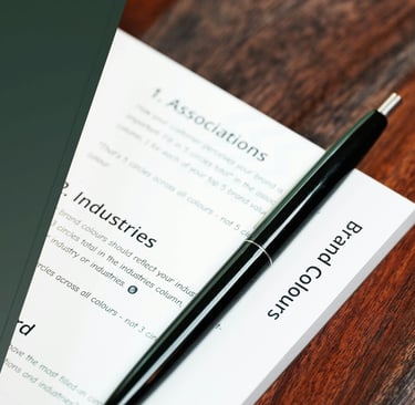green notebook, document and pen