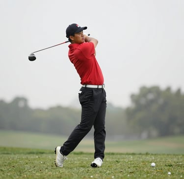 A boxer in a dimly lit gym, shadowboxing with wrist and ankle sensors glowing faintly.