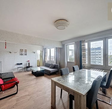a dining room with a table and chairs