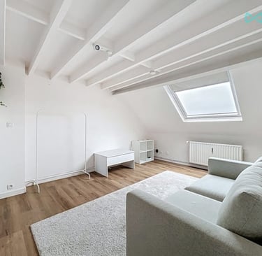 a living room with a couch and a couch