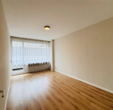 a room with a window and a window