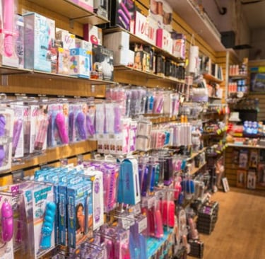 Online Adult toy shop shelves stocked with vibrators, dildos, and sexual wellness products