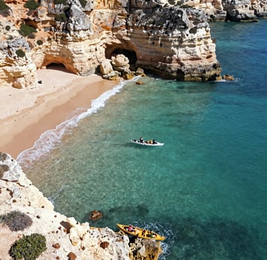 An elegant aerial perspective of the rugged Algarve coastline with turquoise waters and cliffs.