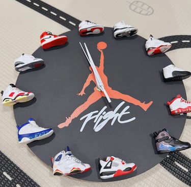 Creative Jordan Jumpman wall clock featuring miniature Air Jordan sneaker models as hour markers.