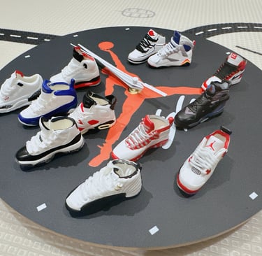 Miniature Air Jordan sneaker collection displayed on a round Jumpman clock face for home decor.