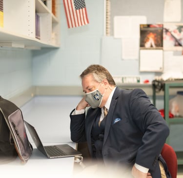 Dave writing at work on a lonely day during Covid