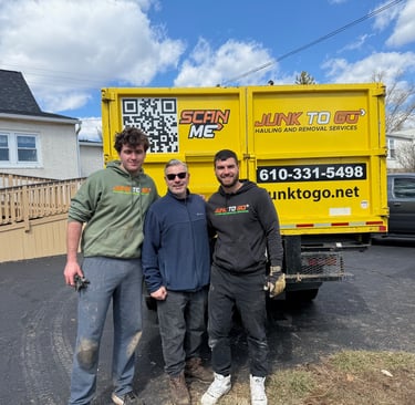Junk to Go crew with truck in Montgomery County, 610-331-5498.