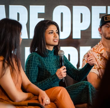 Niki Shamdasani speaking on TikTok growth panel at TikTok event, handheld mic, audience Q&A