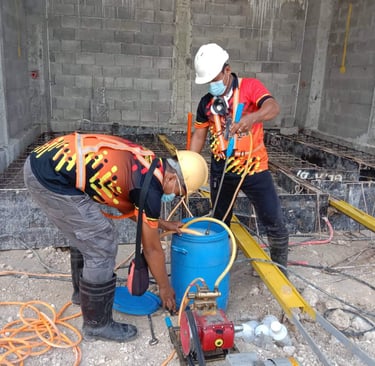 Technician from Jansen Pest Control performing soil poisoning