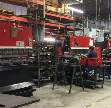 precision fabrication of stainless steel cabinets using industrial machinery