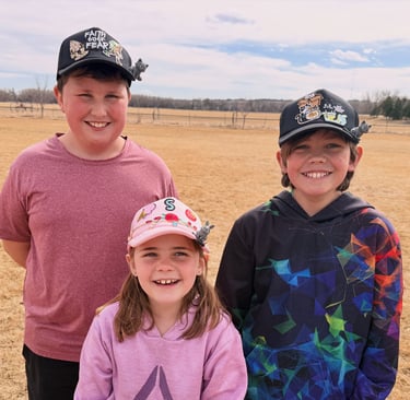 3 kids wearing hats with patches, chains and BrimPets