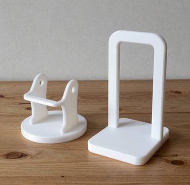 Close-up of a handcrafted wooden organizer holding stationery on a minimalist desk.