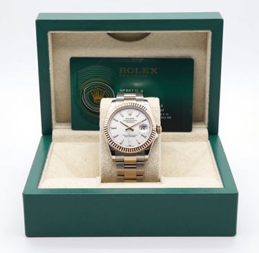 Close-up of a vintage silver necklace with intricate details resting on a velvet cloth.