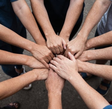 Community members warmly greeting each other before starting a Sunday service in a cozy church setting.